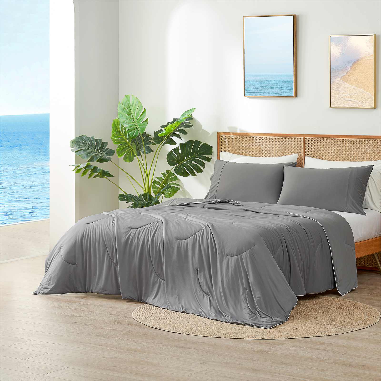 Dark grey cooling comforter on bed in coastal bedroom.#Color_Dark Grey