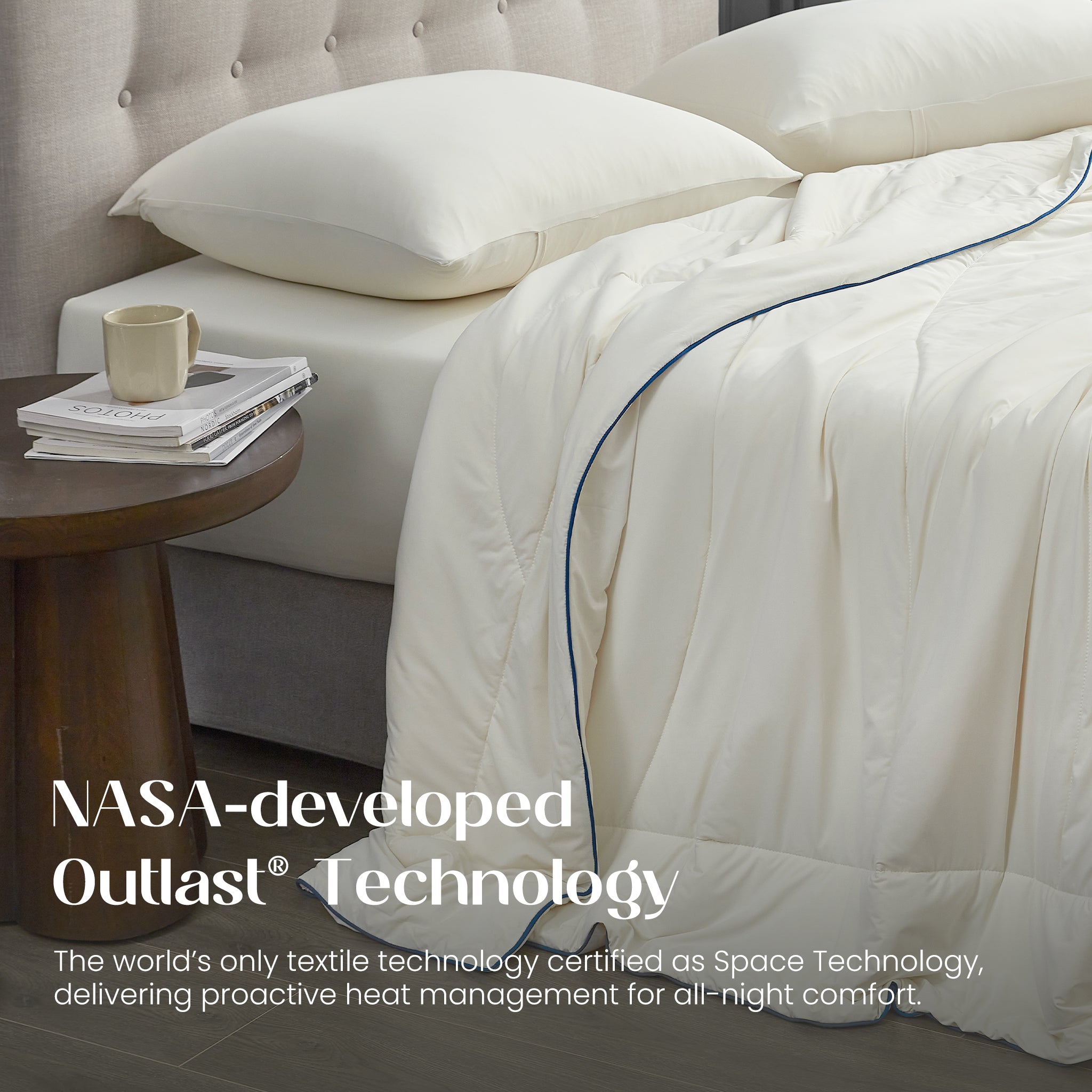 Bed with ivory bedding and pillows, featuring NASA-developed Outlast Technology text.#color_Ivory