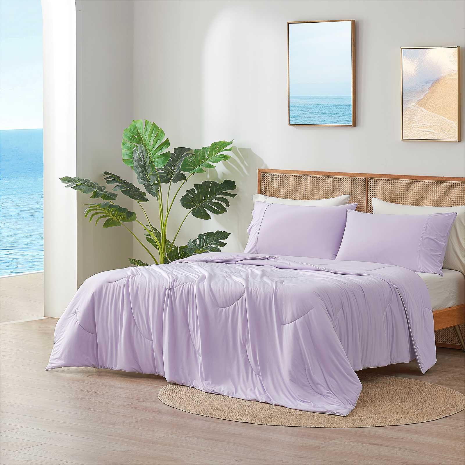 Purple cooling comforter on bed in coastal bedroom.#Color_Lavender Purple