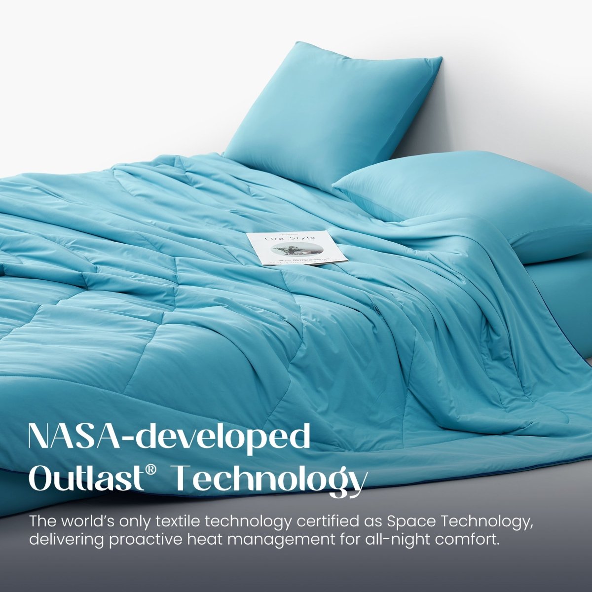 Blue comforter with pillows on a bed, featuring NASA-developed Outlast Technology text.#color_Dream Blue