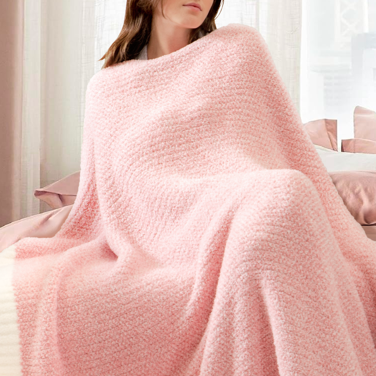 Woman wrapped in a Heather Feather Yarn Throw Blanket in Pink, enjoying relaxation. #color_Pink
