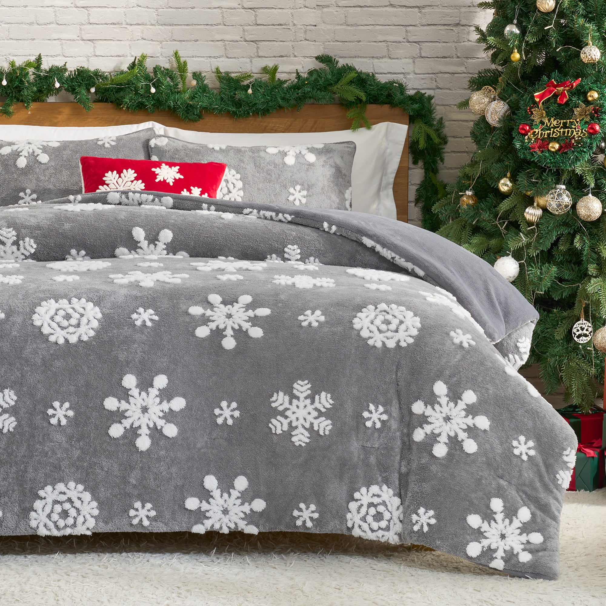 Gray bedding with snowflake pattern in a room decorated for Christmas. #Color_Snowflake Grey
