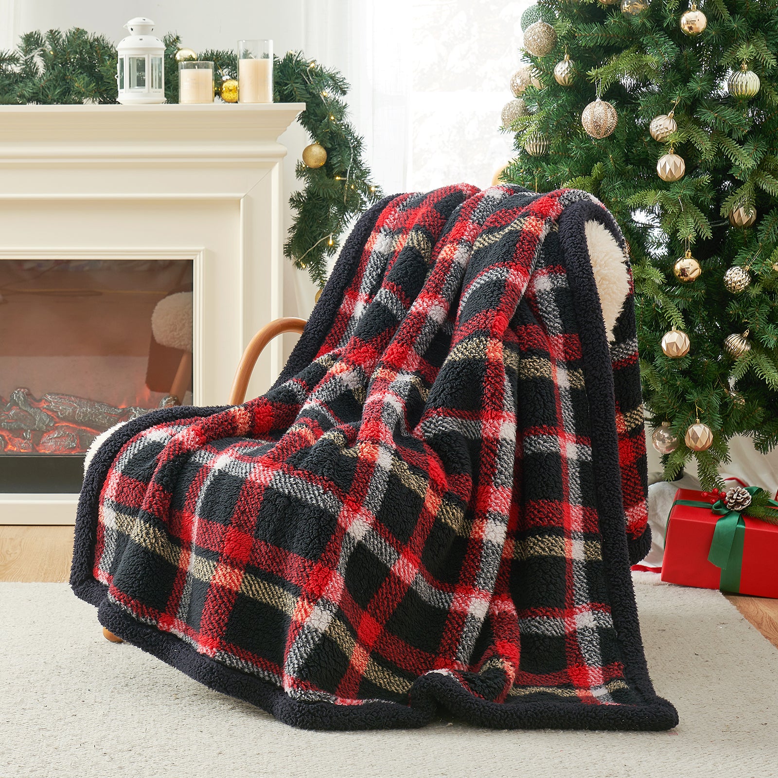 Plaid blanket draped over a chair in a festive living room with a Christmas tree and fireplace. #Color_Scotland Plaid Red