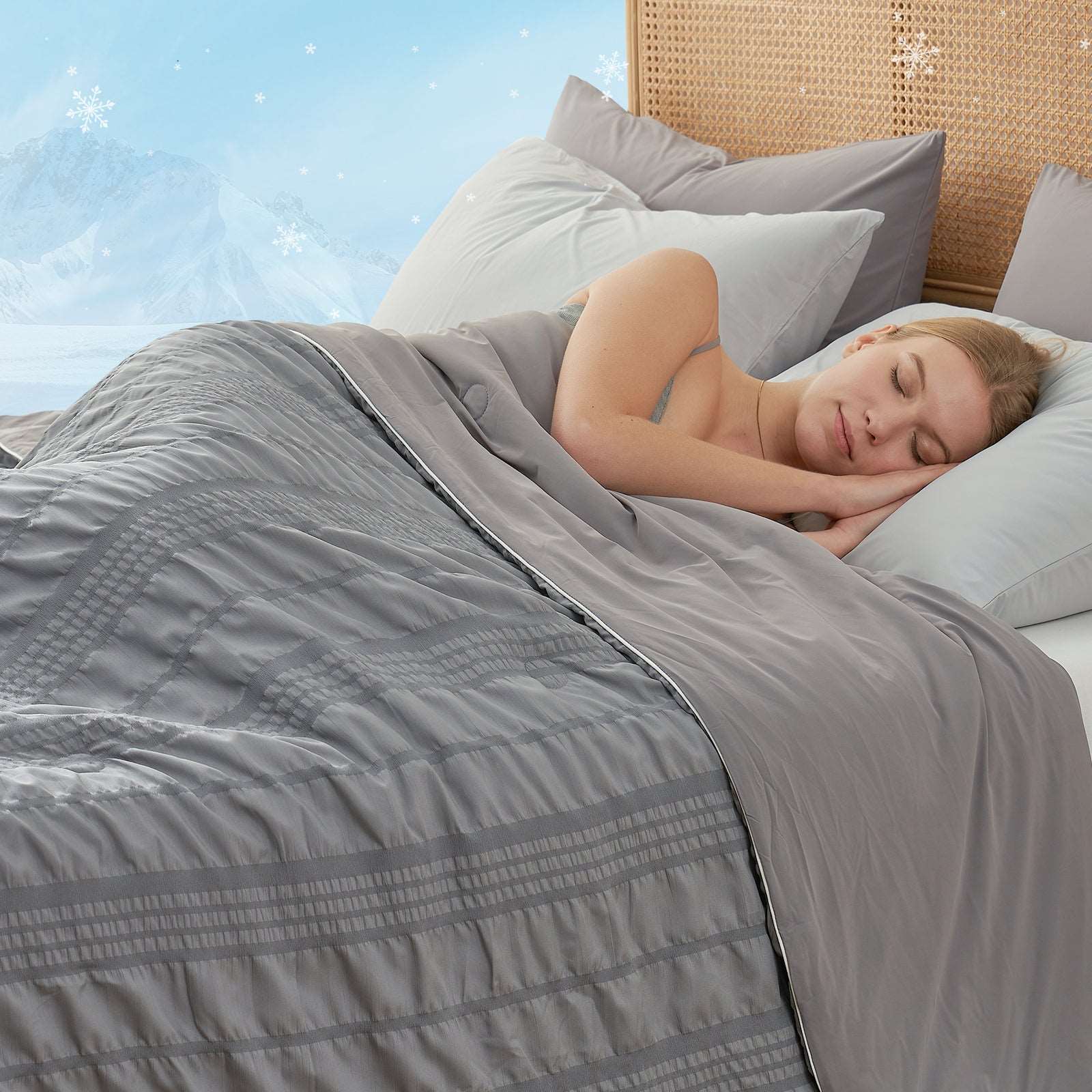 Woman sleeping under Cozy Bliss cooling comforter, gray color #color_Dark Grey