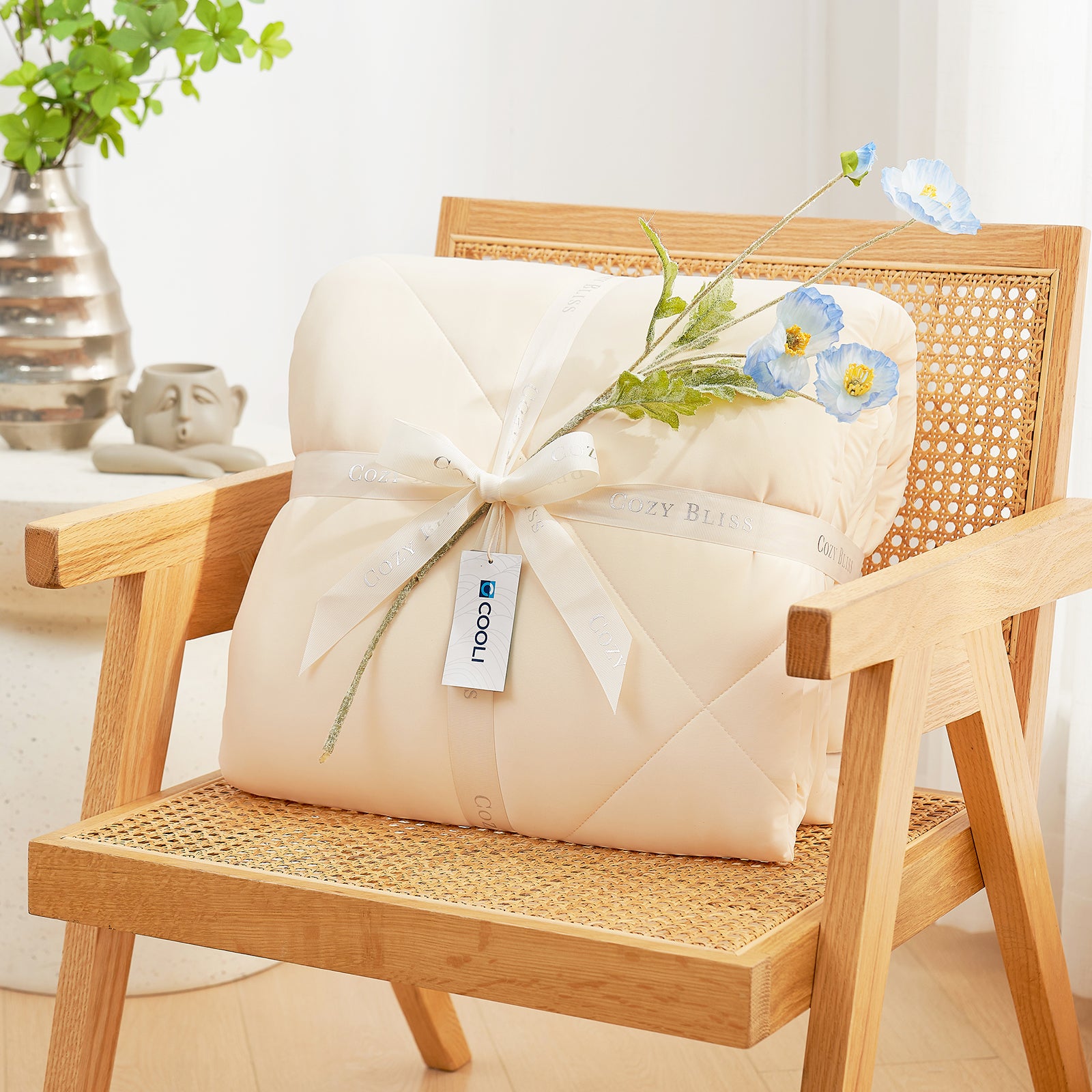 Cozy Bliss cooling comforter, beige, rolled and tied with ribbon, premium cooling blanket. #Color_Yellow