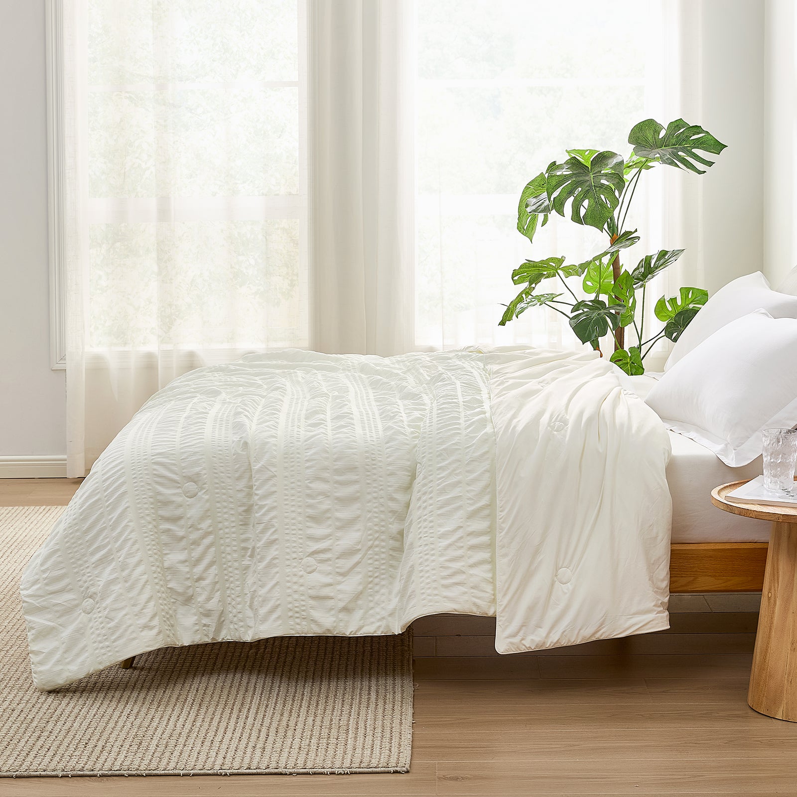 Seersucker Cooling Comforter on bed, ivory-white, breathable & soft for cozy sleep #color_Cream White