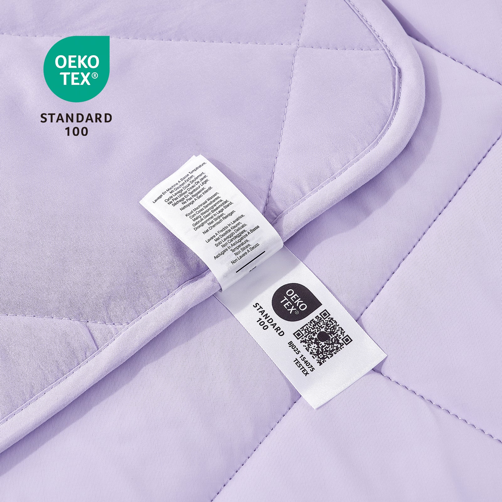 Purple quilt with OEKO-TEX Standard 100 labels on a matching background #color_Purple