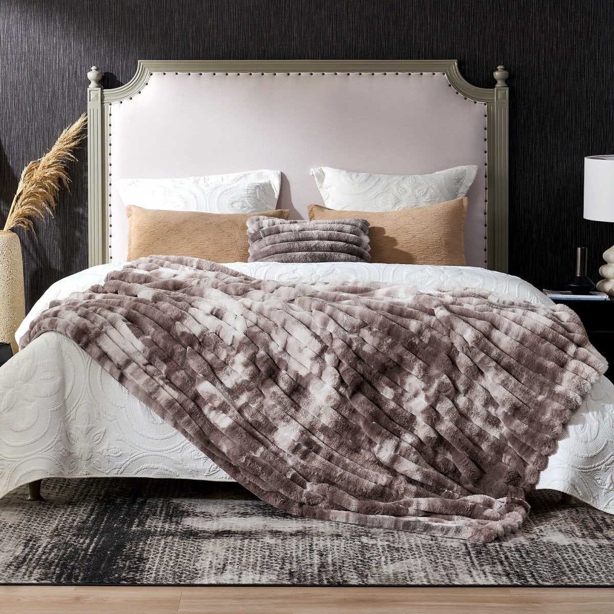 A fluffy striped faux fur throw blanket on bed. #color_Tie-dye Taupe