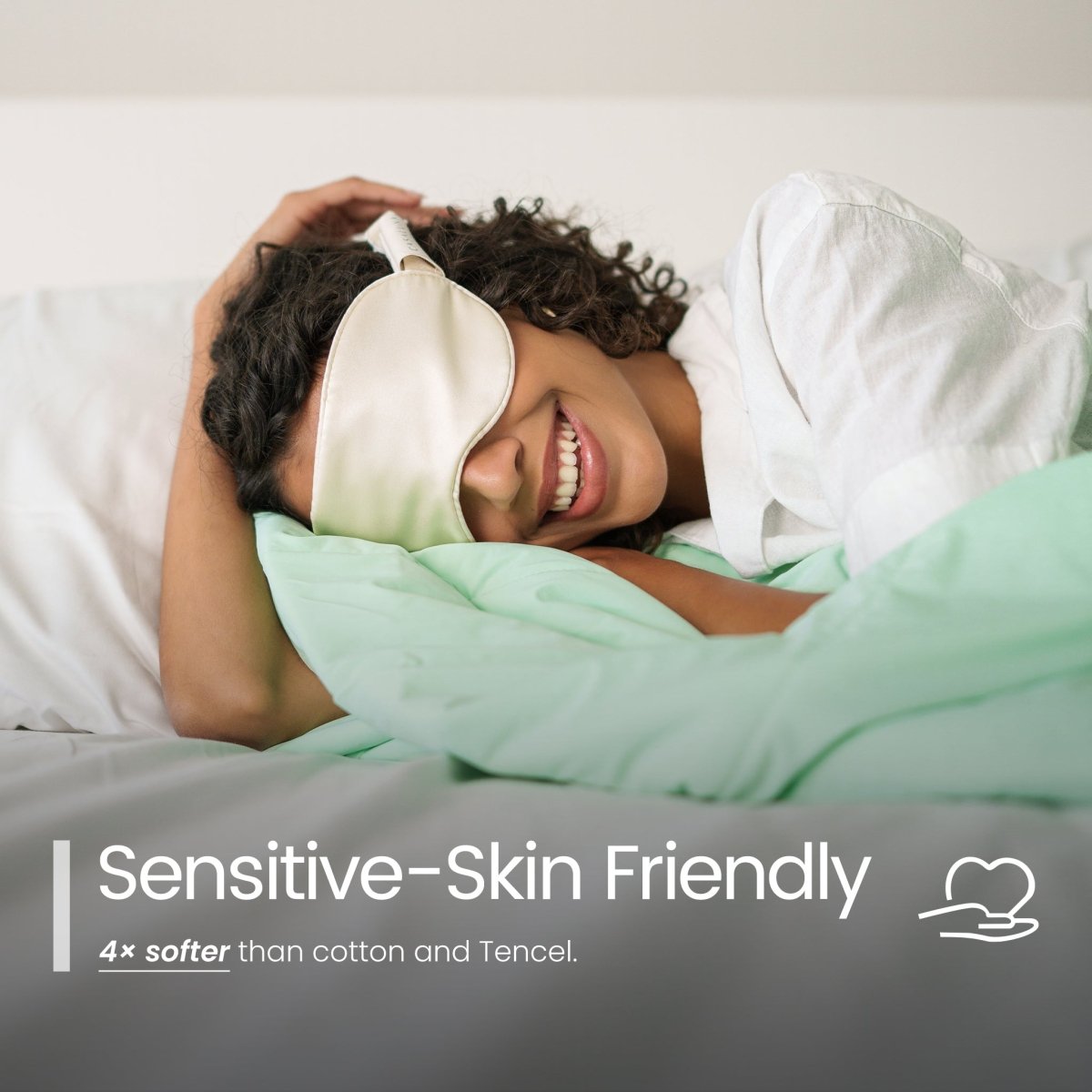 Person wearing a silk sleep mask with comforter with text about sensitive-skin friendliness.#color_Mint Macaron