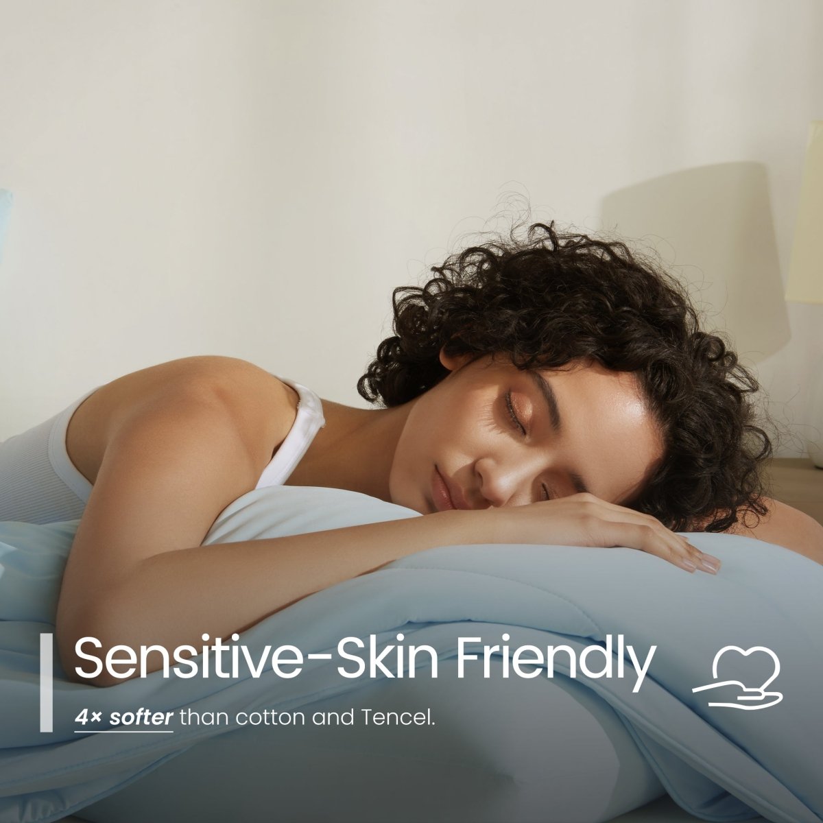 Woman sleeping peacefully with 'Sensitive-Skin Friendly' text overlay#color_Sky Blue