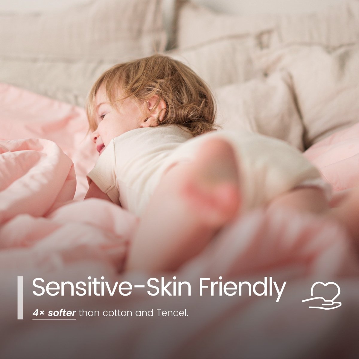 Child sleeping under a pink blanket with text 'Sensitive-Skin Friendly' and '4x softer than cotton and Tencel'.#color_Pink