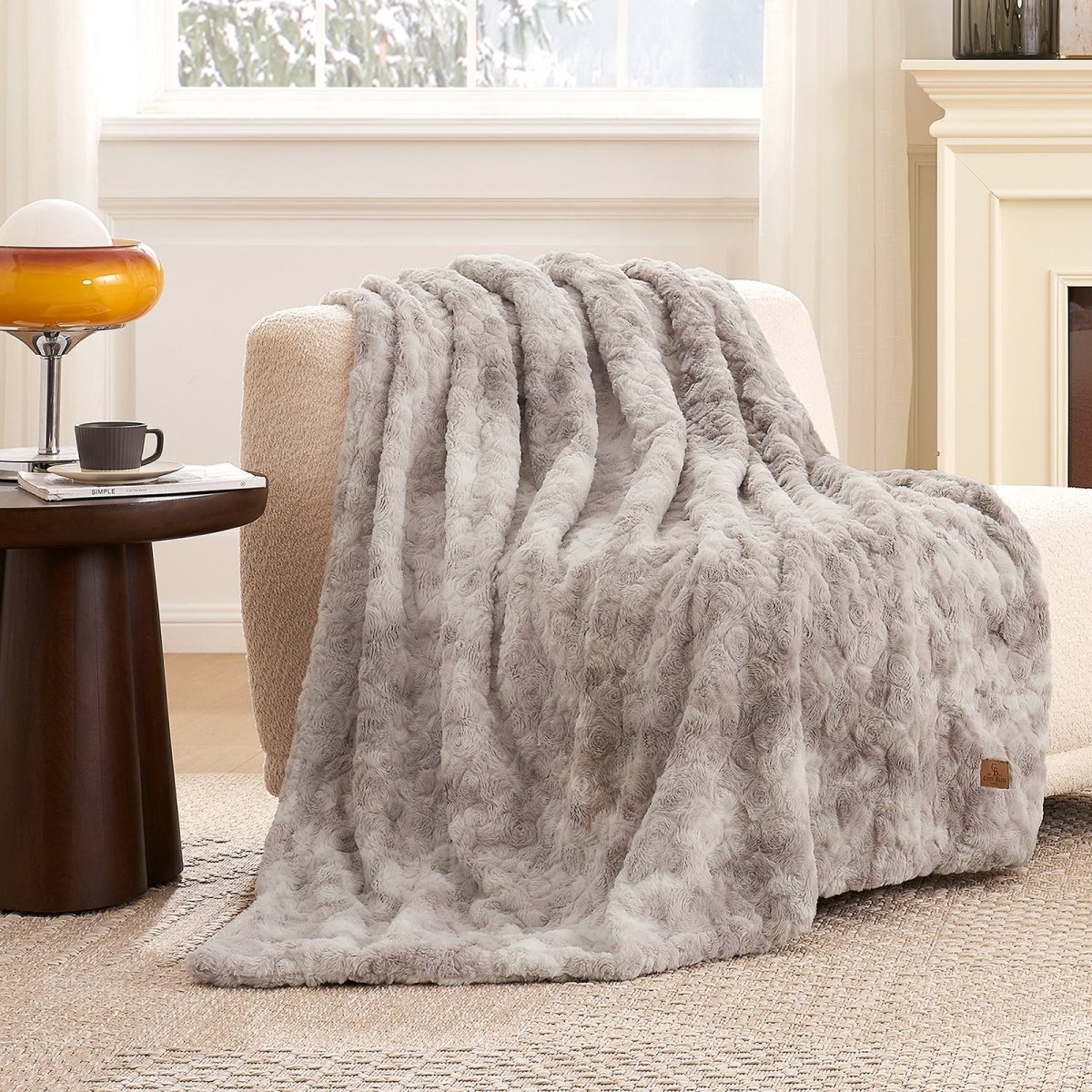 Premium Brushed Faux Fur Throw Blanket draped over a modern accent chair with elegant plush texture #color_Tie-dye Taupe