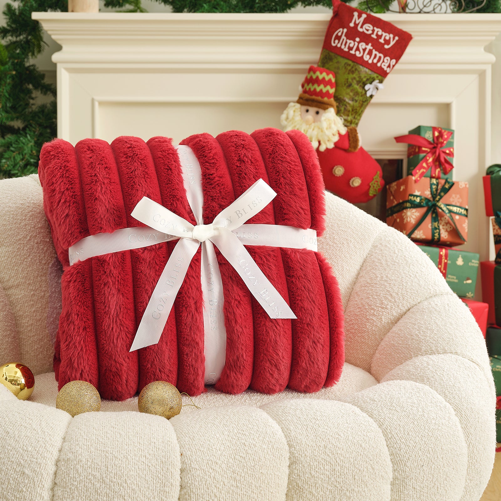 Red blanket with a white bow on a white armchair in a festive setting with Christmas decorations. #color_Cardinal Red