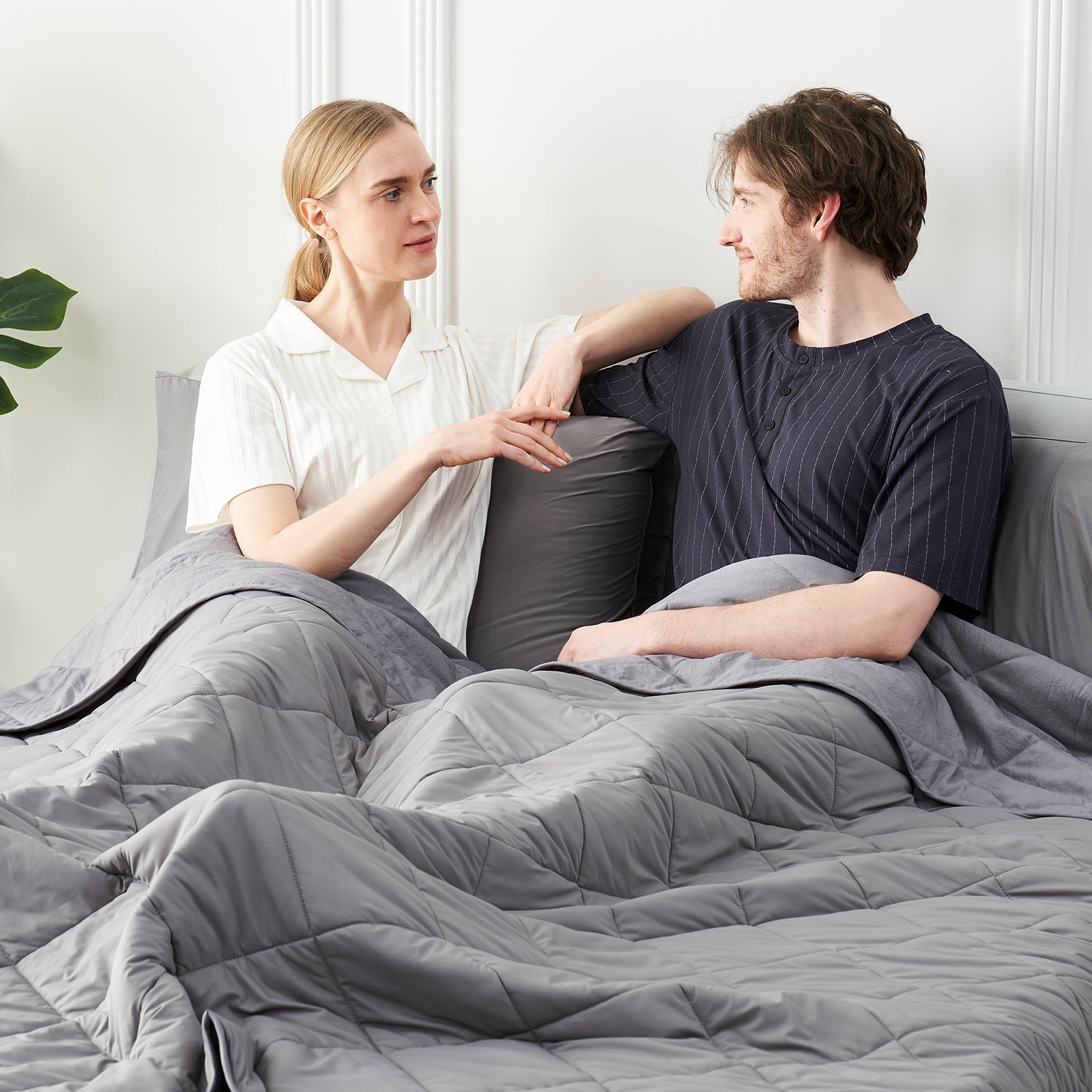 Couple relaxing with a dark grey cooling blanket. Perfect for hot sleepers. #Color_Dark Grey