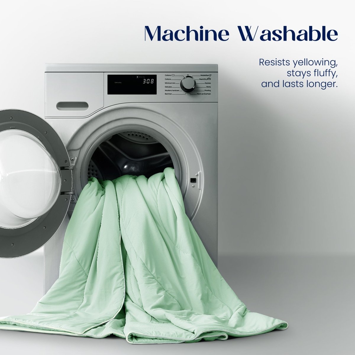 Green comforter draped over an open dryer with text about machine washability.#color_Mint Macaron