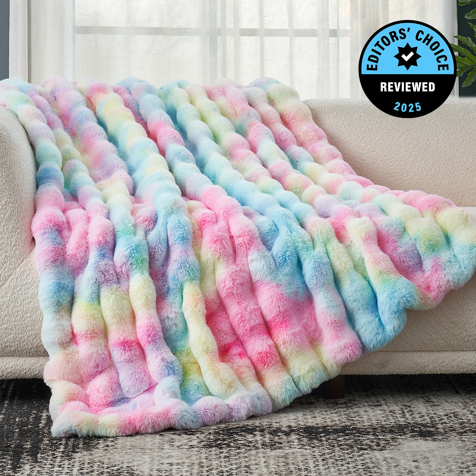 Multicolored fuzzy blanket on a couch with 'Editors' Choice' badge. #Color_Tie-dye Rainbow