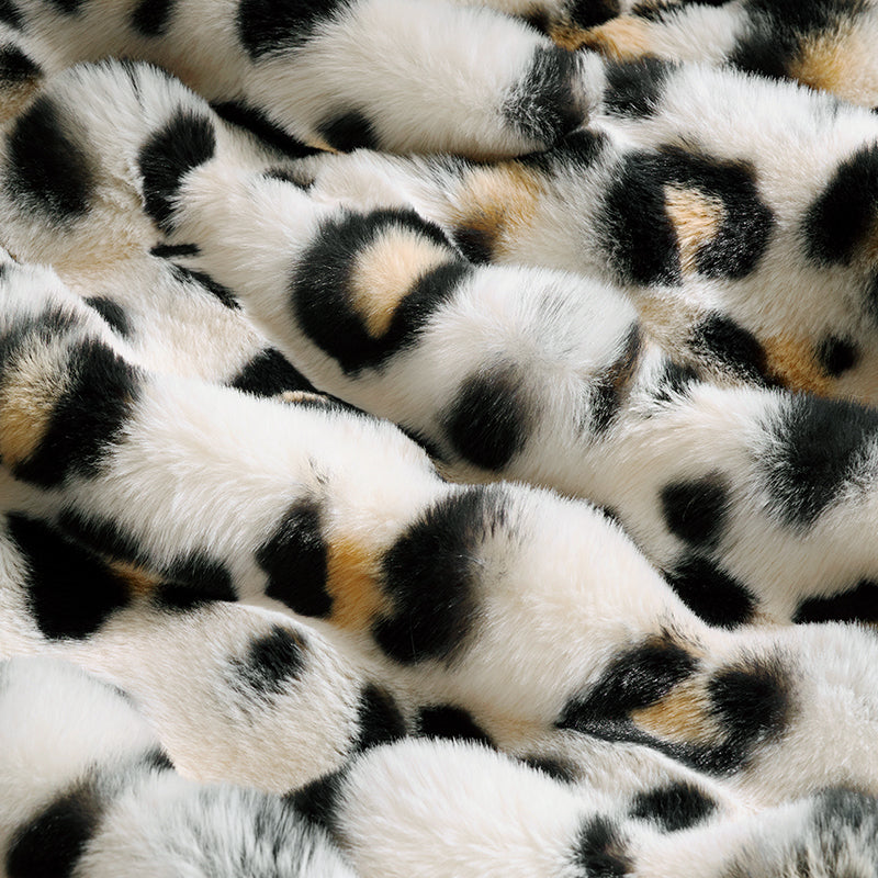 Close-up of a patterned fabric with black, brown, and white colors. #Color_Leopard
