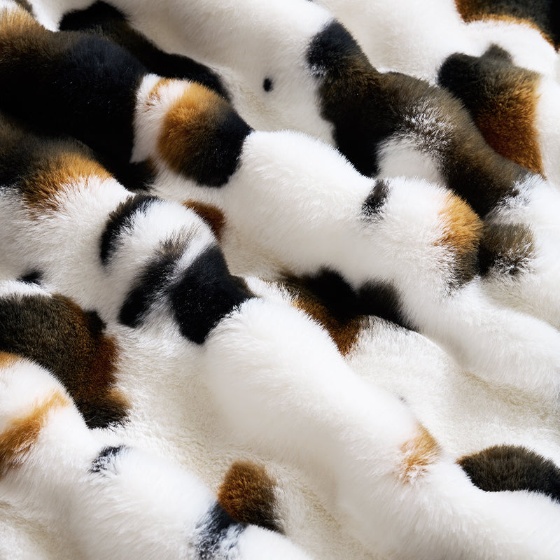 Close-up of a patterned fabric with white, brown, and black colors. #Color_Cow