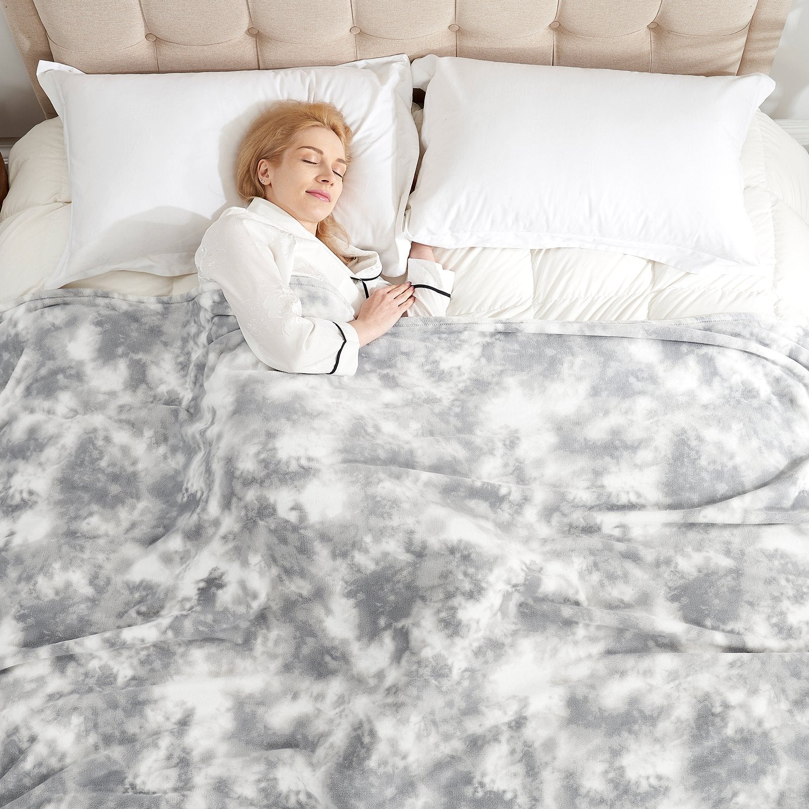 Woman sleeping under gray tie-dye MilkyPlush™ blanket. Cozy blanket for comfortable sleep and relaxation. #color_Tie-dye Grey