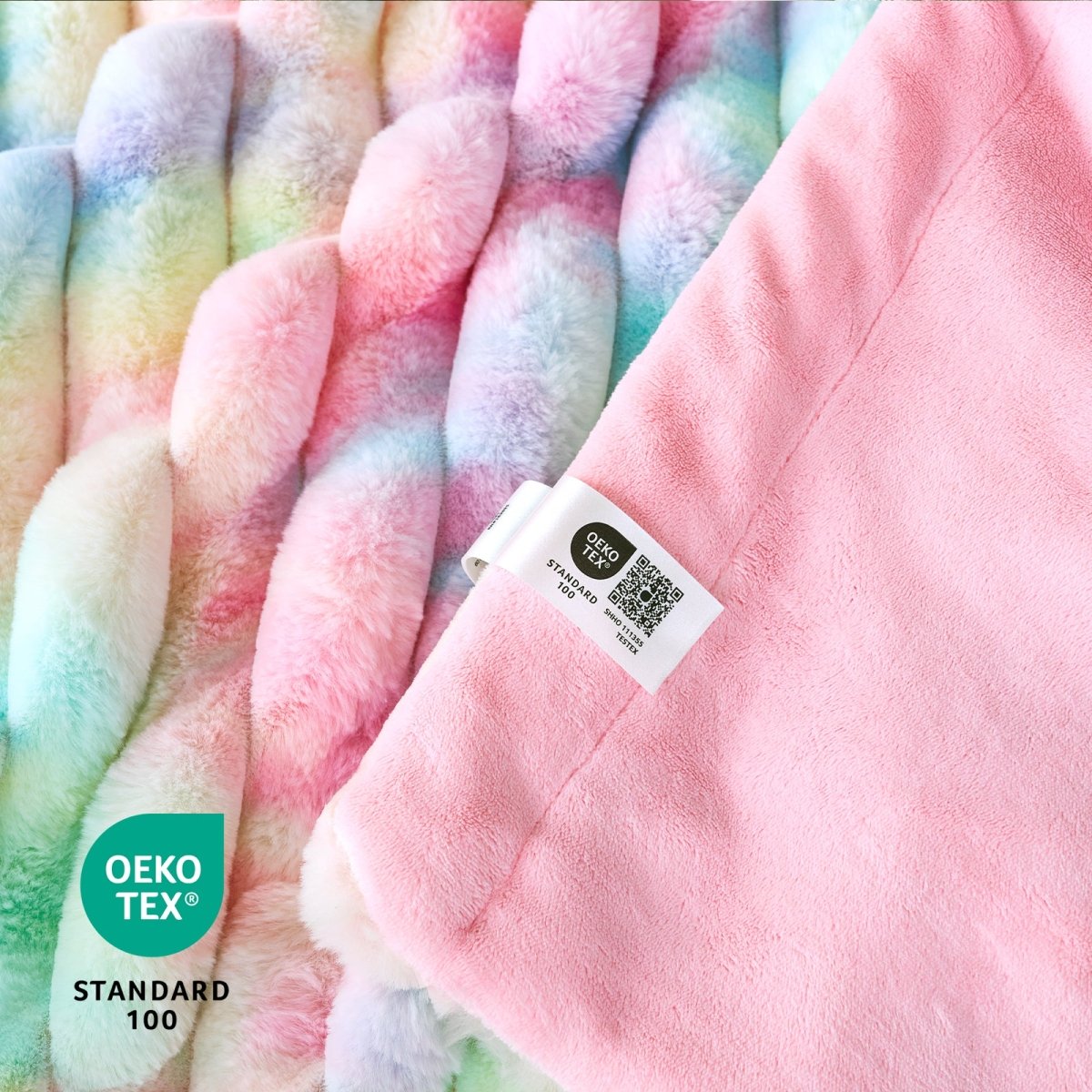 Close-up of a soft, multicolored fabric with an Oeko-Tex label. #color_Tie-dye Rainbow