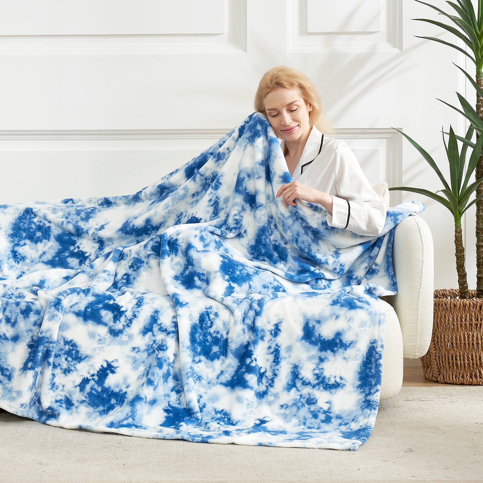 Cozy woman with blue tie-dye blanket. Soft, breathable blanket for relaxation and comfort. #color_Tie-dye Blue