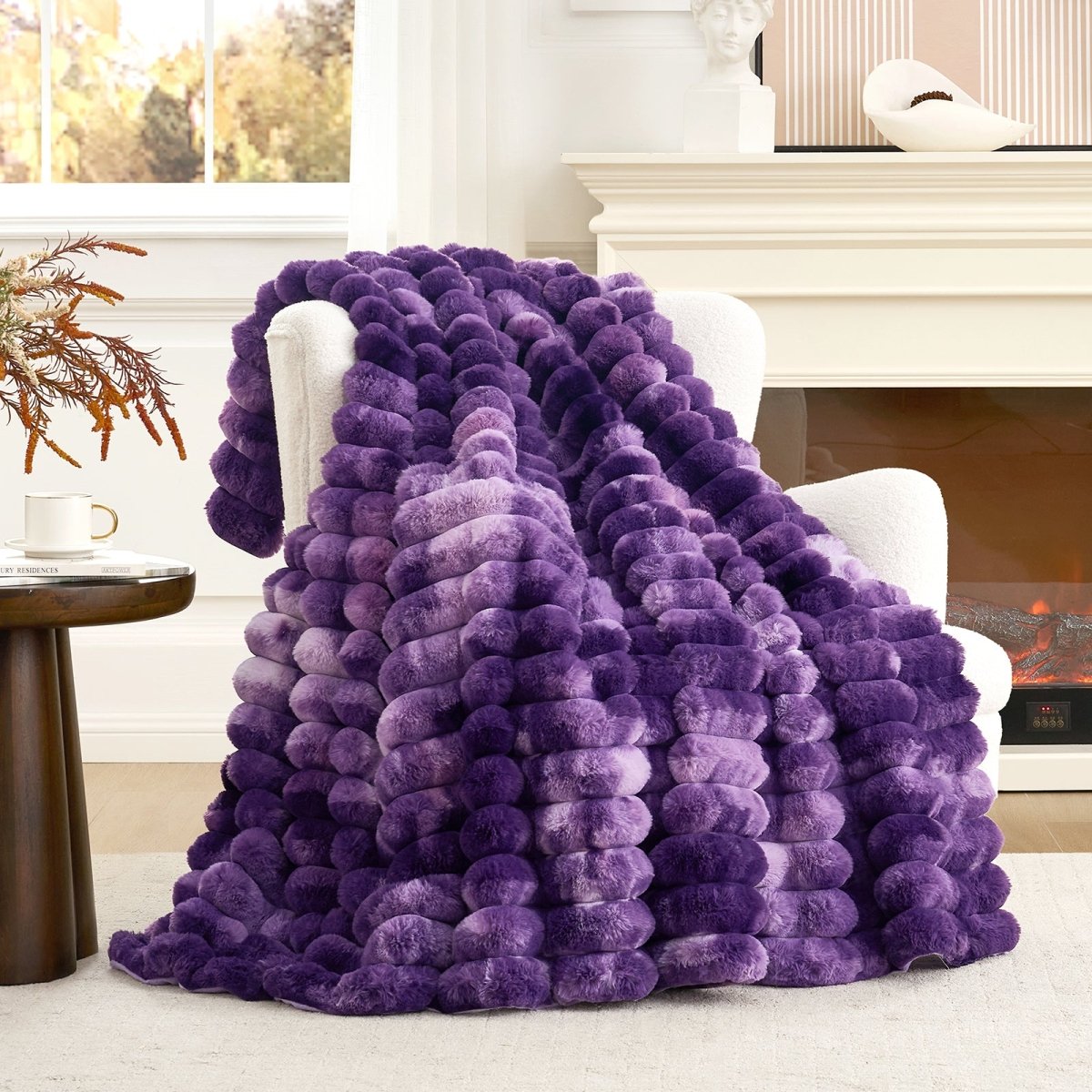 Cozy Bliss tie-dye purple striped faux fur blanket draped on a sofa. Cozy bedding and soft blanket. #color_Tie-dye Purple