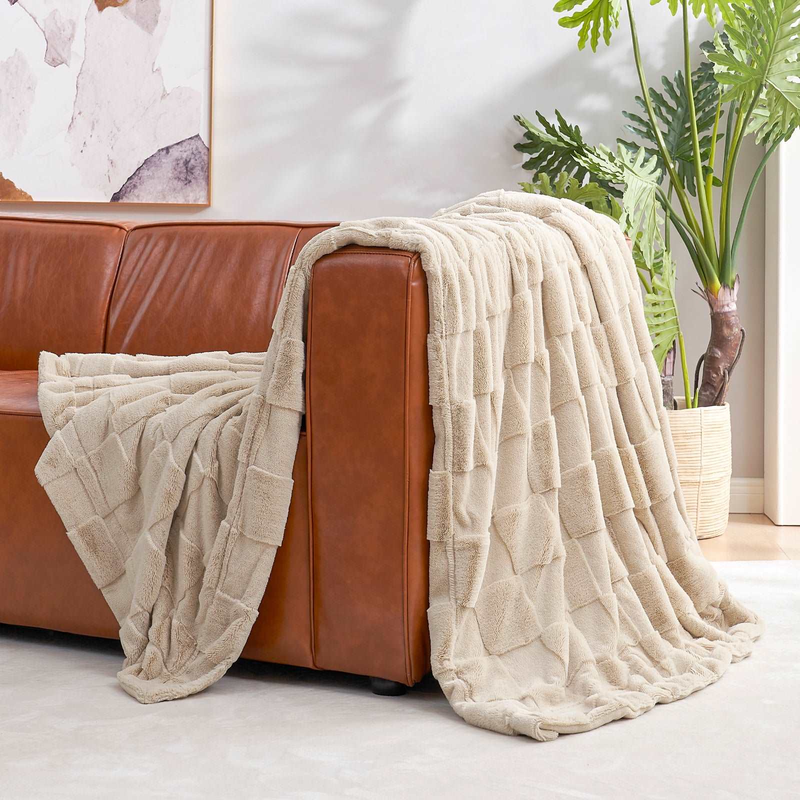 Cozy Bliss cream checkboard faux fur blanket on brown sofa #color_Beige