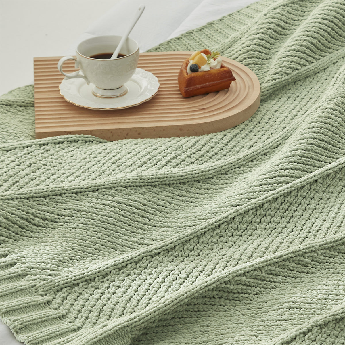 Chevron Chenille Knit Throw Blanket in Sage Green close-up view, showcasing soft chenille yarn and textured knit pattern. #color_Sage Green