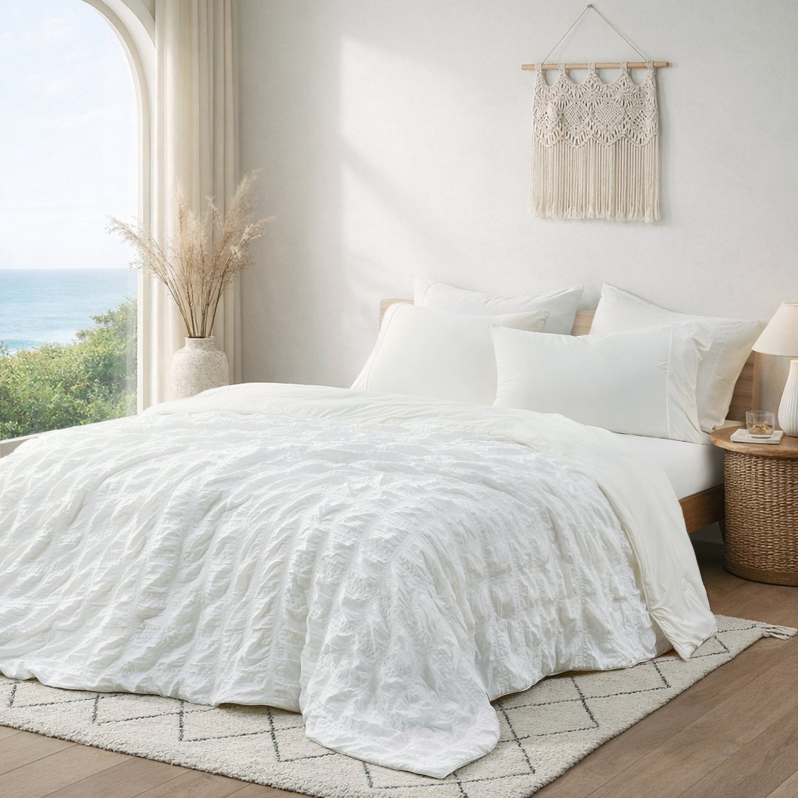 Cozy Bliss white seersucker cooling comforter in bright coastal bedroom, breathable lightweight bedding with textured fabric.#Color_White Plaid