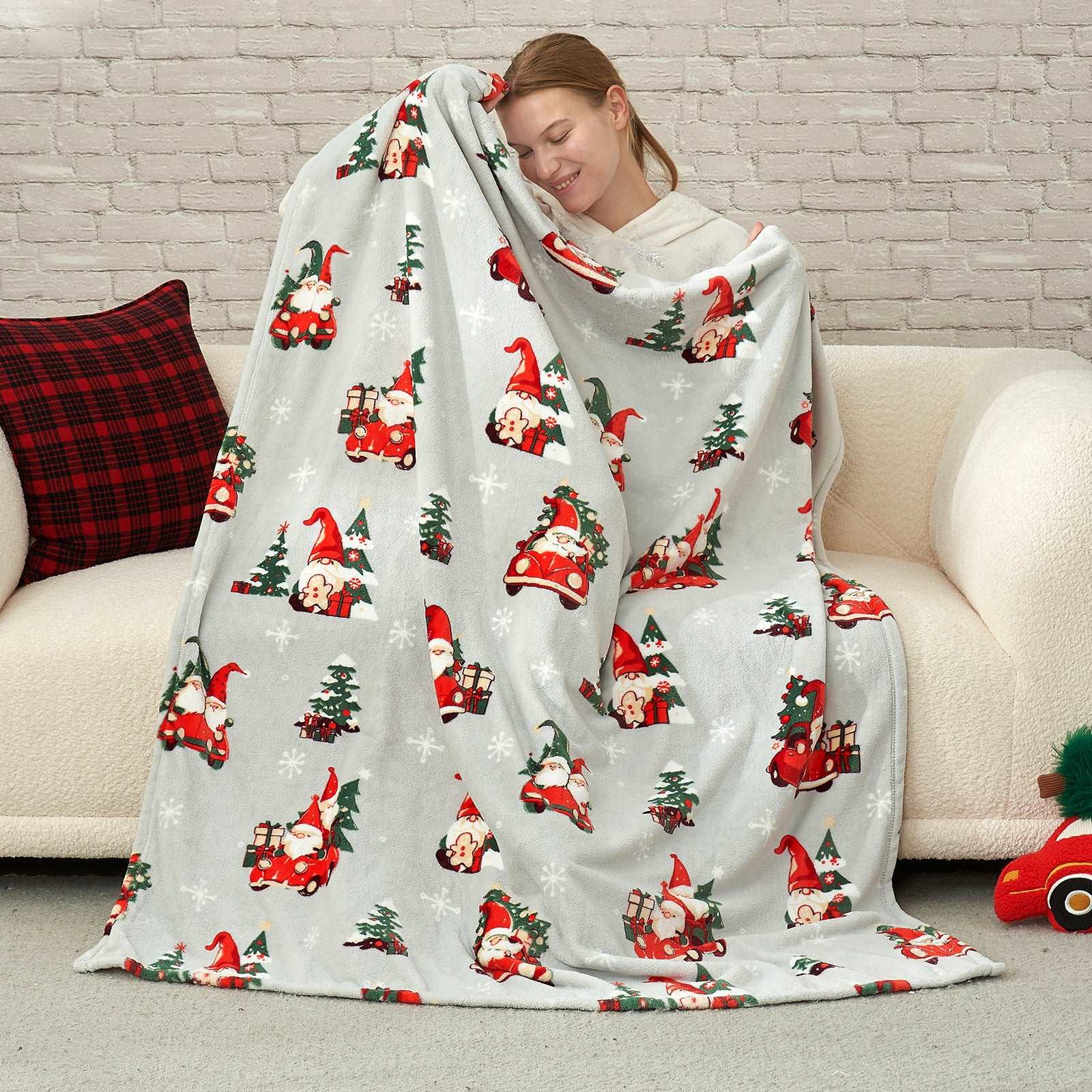 Woman with Cozy Bliss Gnomes MilkyPlush™ Throw Blanket #color_ Gnome in Truck