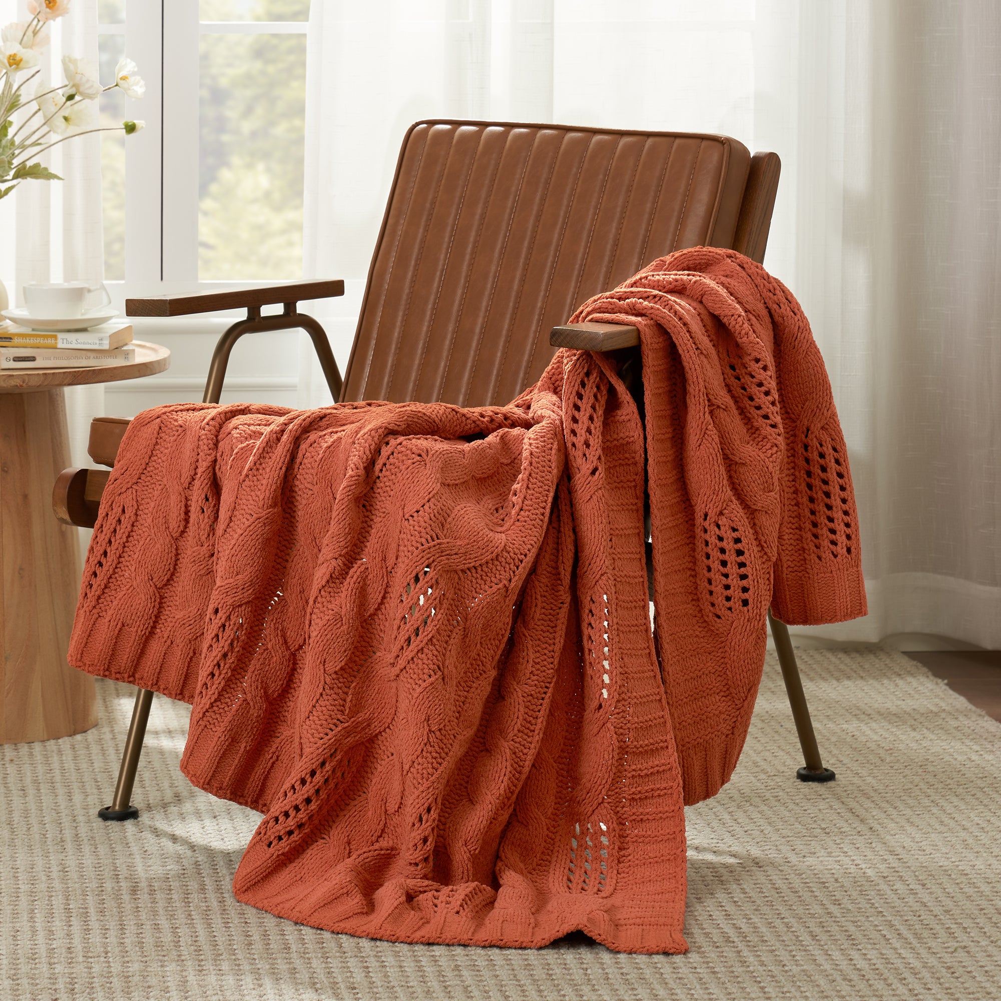 Chenille Cable Knit Throw Blanket in Burnt Orange front view draped over an armchair, showcasing rich color and textured knit design. #color_Burnt Orange