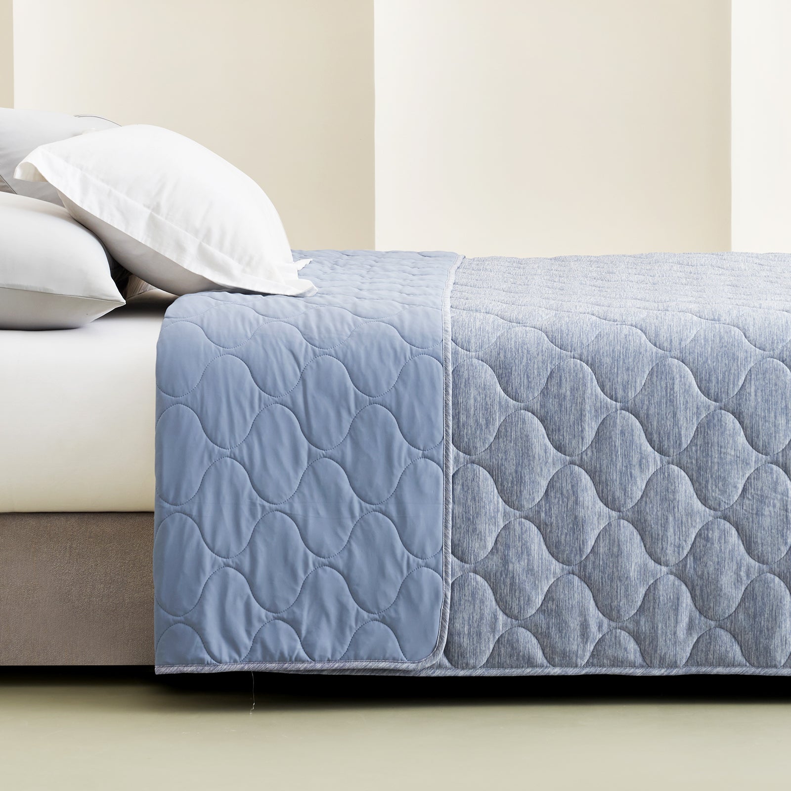 Cozy Bliss Dual-Sided Cooling Blanket in blue cloud pattern on bed, soft and breathable bedding #color_Denim Blue