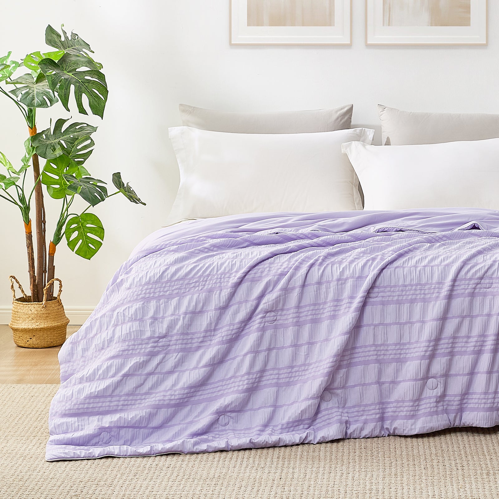 Cozy Bliss Lavender Cooling Comforter on a bed with white pillows, showcasing breathable design for cool sleep. #color_Purple