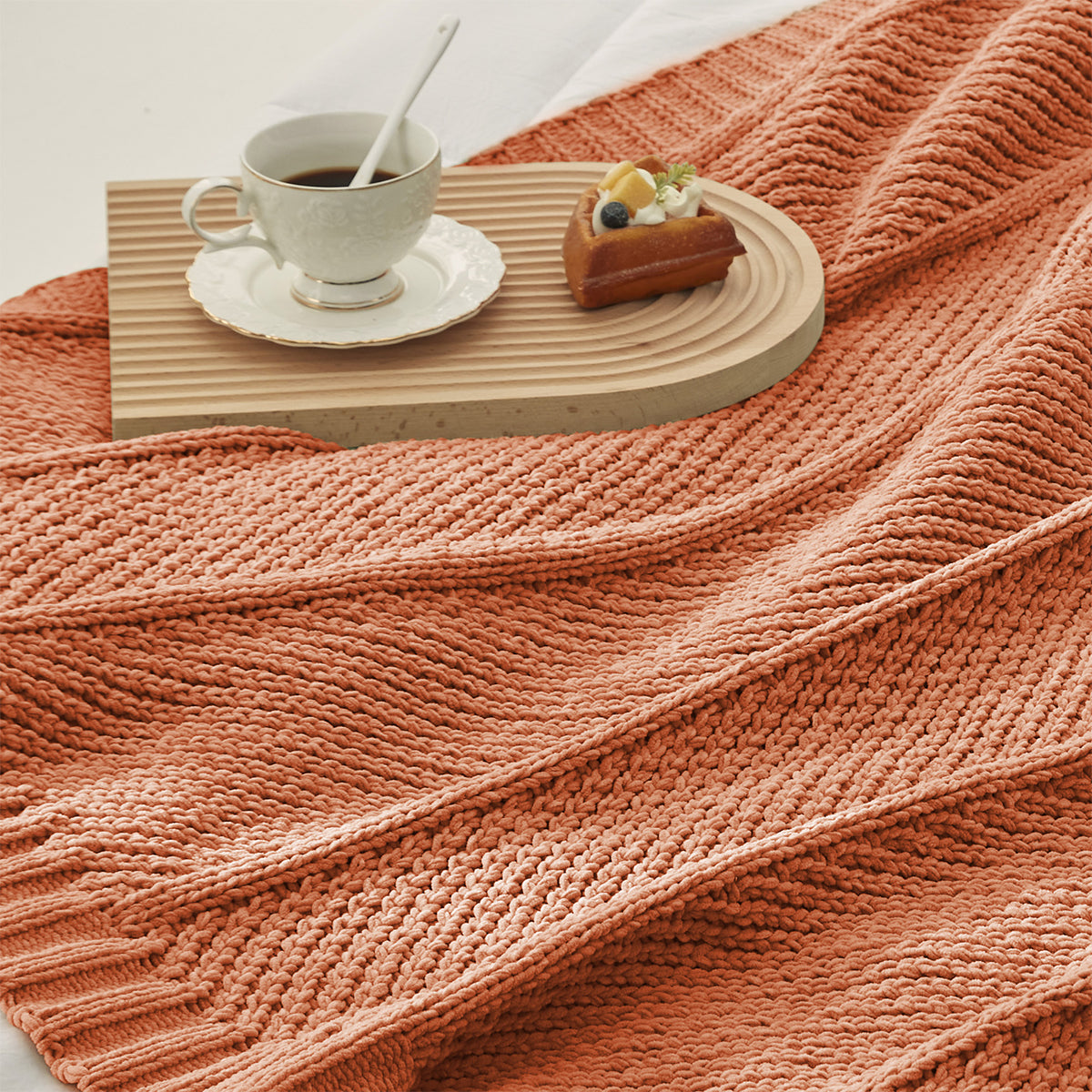Chevron Chenille Knit Throw Blanket in Orange close-up view, showcasing soft chenille yarn and bold textured pattern. #color_Orange