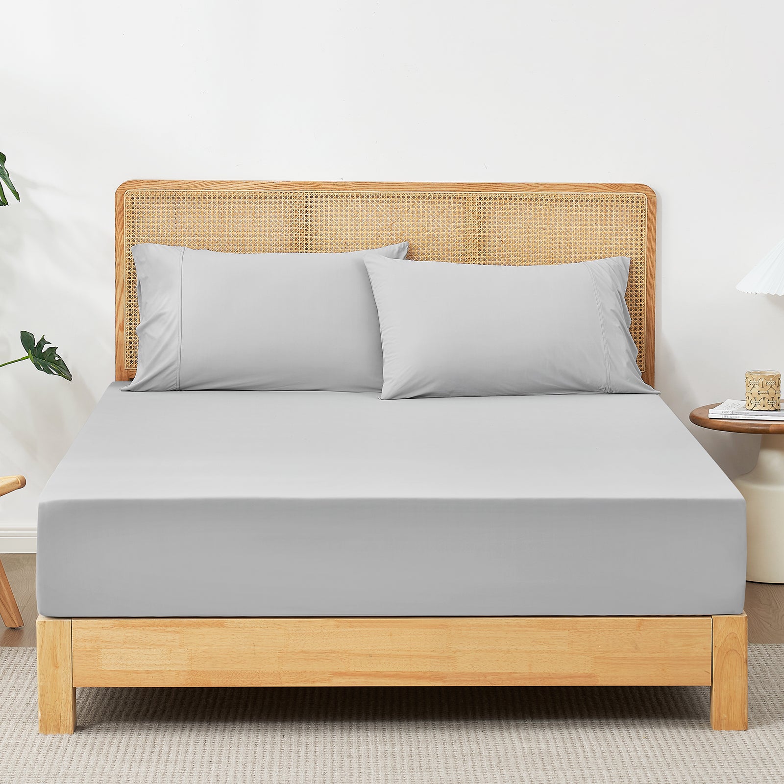 Light gray cooling sheet set with pillowcases on a bed, ultra-soft and breathable bedding #Color_Light Grey