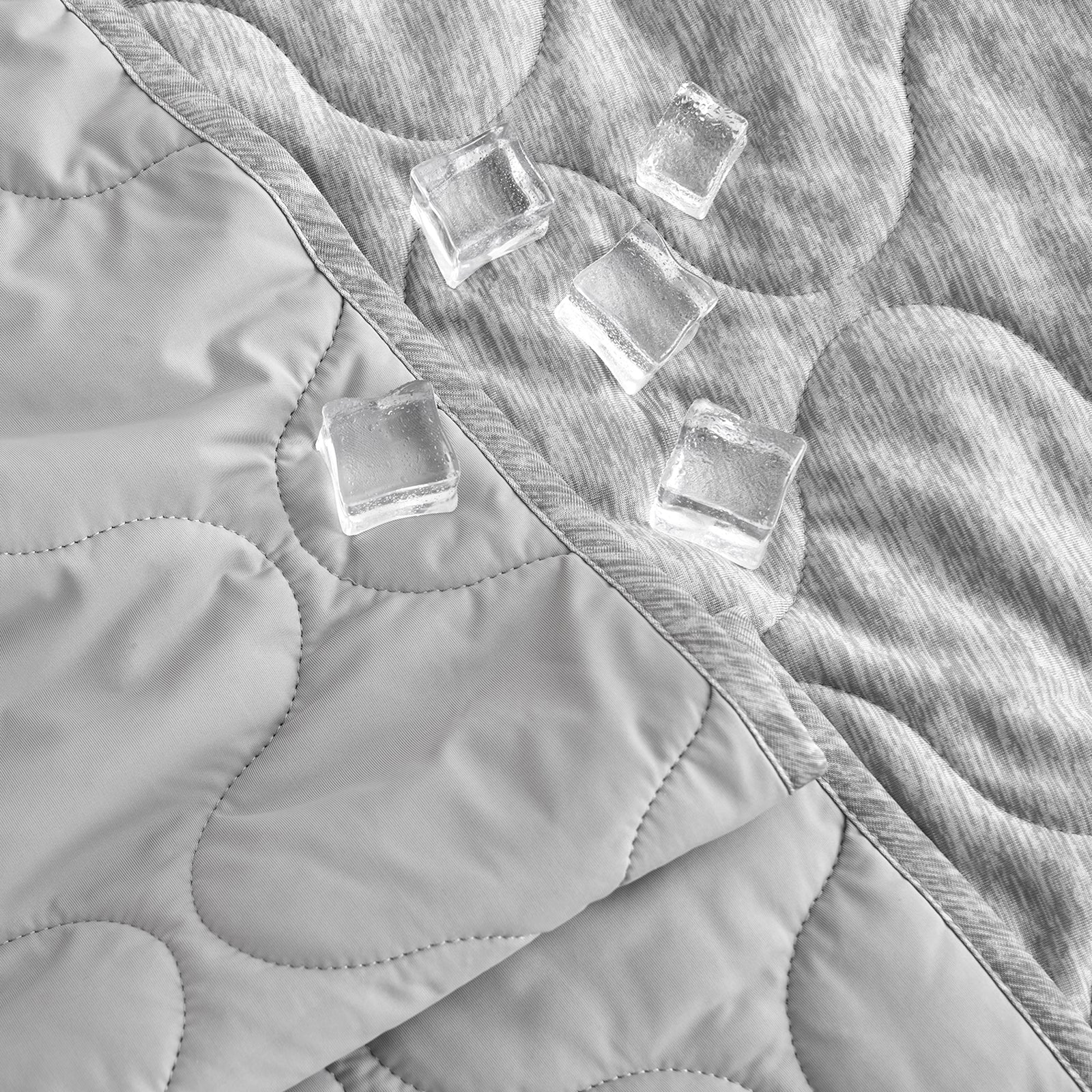 Gray cooling blanket with cloud pattern and ice cubes, highlighting its cooling and soft texture #color_Silver Grey