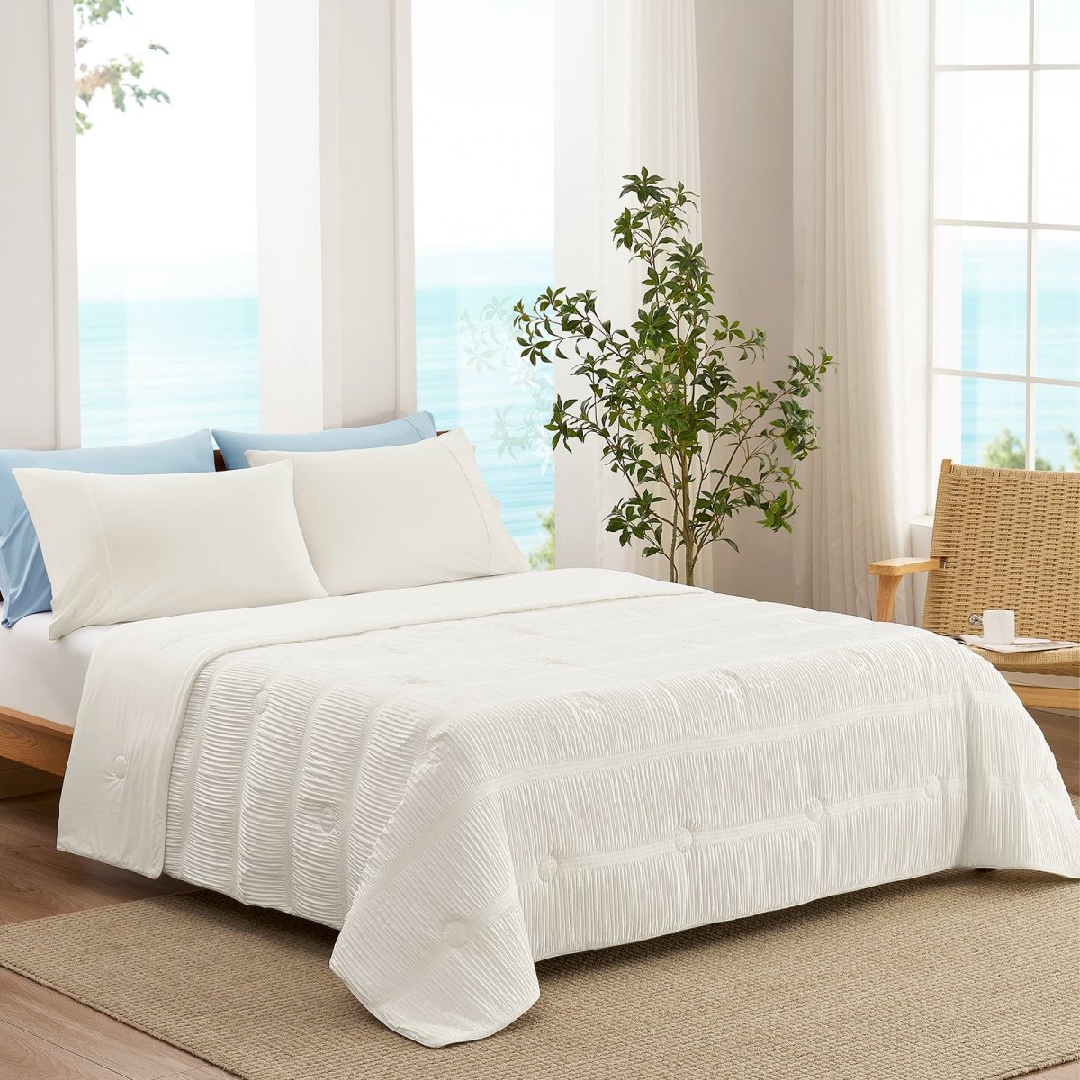 White striped cooling comforter on bed in bright coastal bedroom, breathable lightweight bedding with textured fabric.#color_Off White