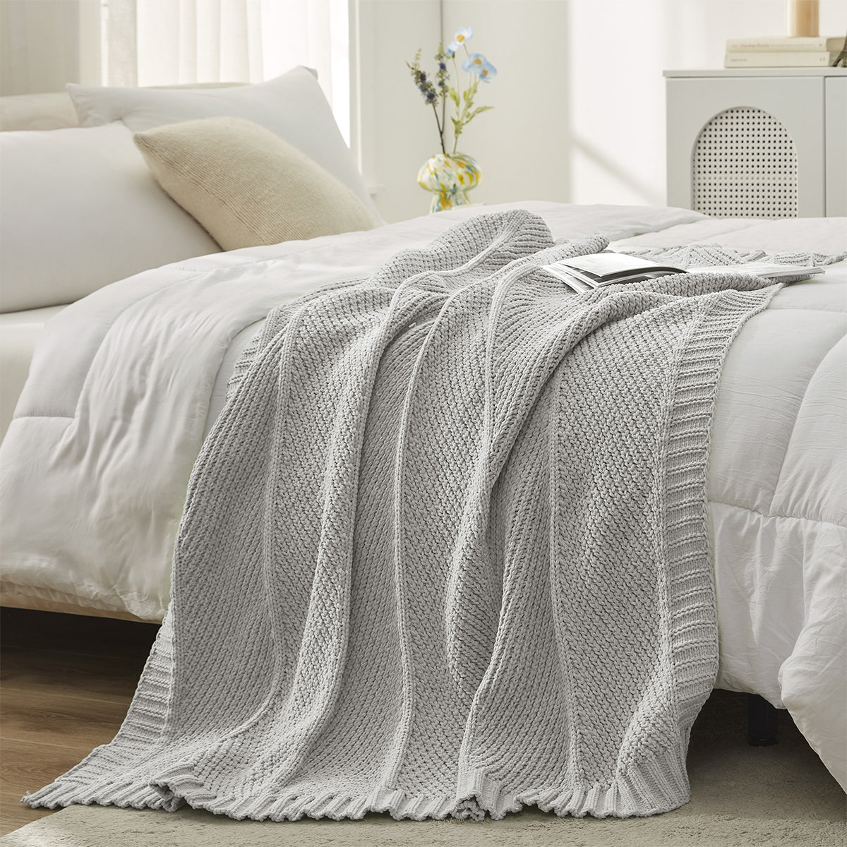 Chevron Chenille Knit Throw Blanket in Light Grey styled on a bed, adding a clean and modern layered look. #color_Light Grey