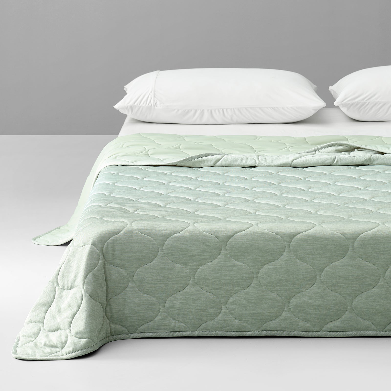 Sage green double-sided cooling blanket on a bed #color_Sage Green