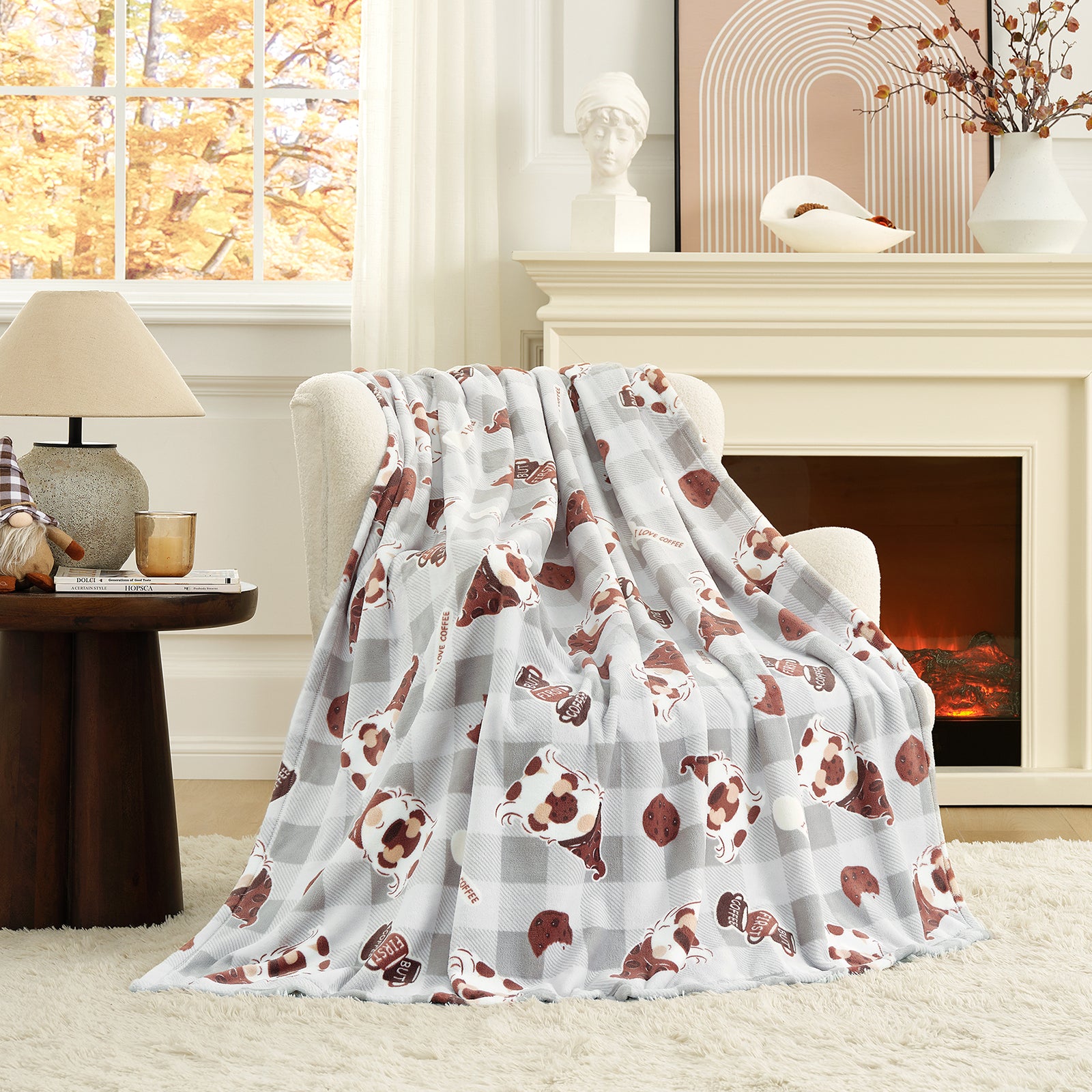 Floral-patterned blanket draped over a chair in a cozy living room with a fireplace. #color_Coffee Gnome Grey