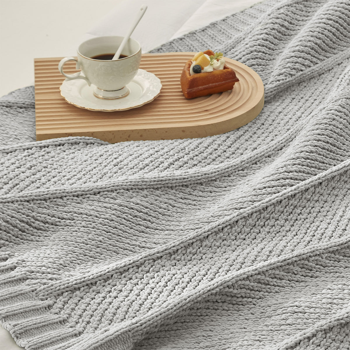 Chevron Chenille Knit Throw Blanket in Light Grey close-up view, showcasing soft chenille yarn and modern knit texture. #color_Light Grey