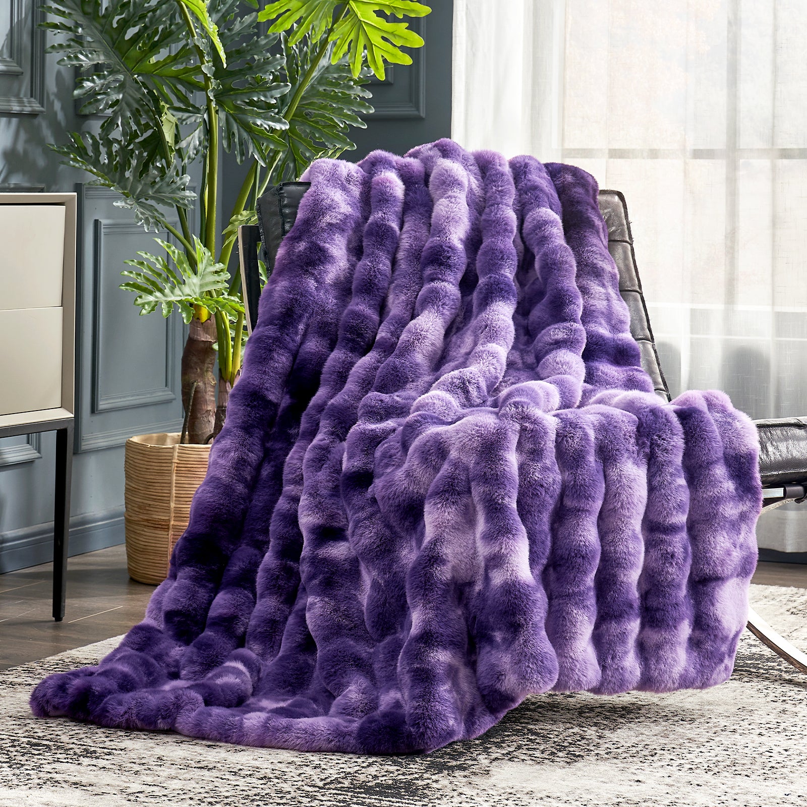 Cozy Bliss purple tie-dye faux fur throw blanket draped on a chair. Soft, cozy and premium. #color_Tie-dye Purple
