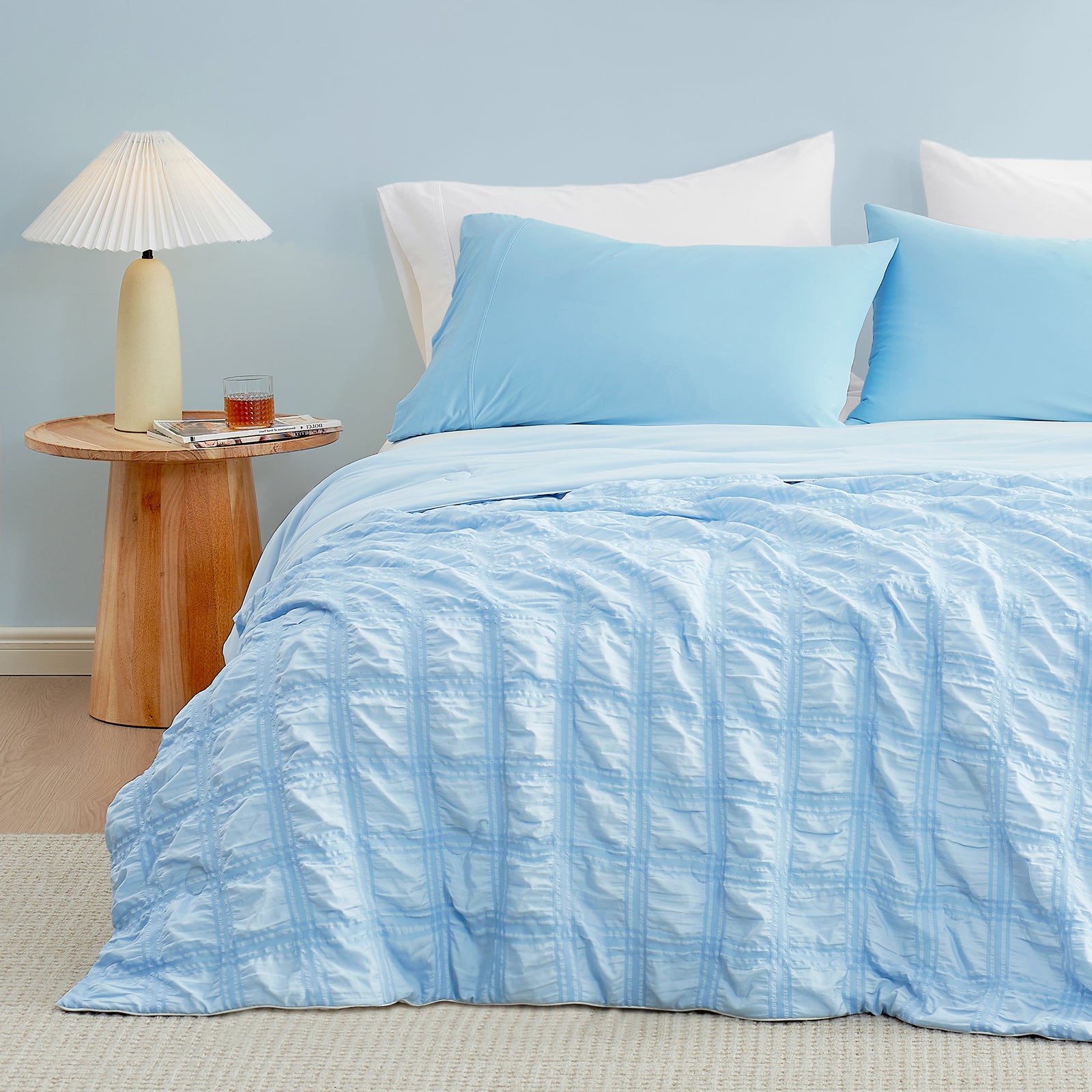 Blue seersucker cooling comforter set on a bed, Cozy Bliss #Color_Blue Plaid