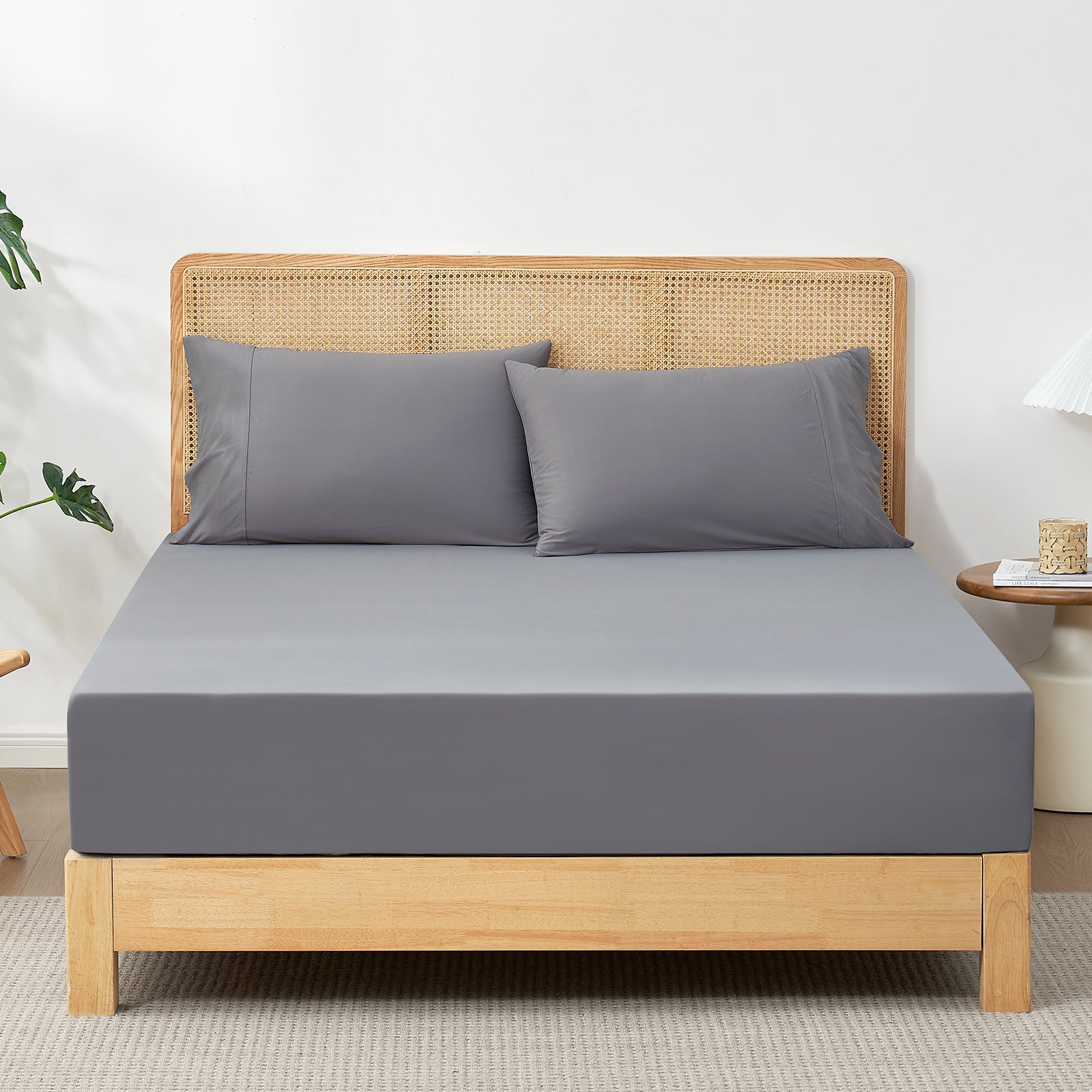 Gray cooling fitted sheet set on a bed. Ultra-soft, breathable, and cozy bedding. #Color_Dark Grey