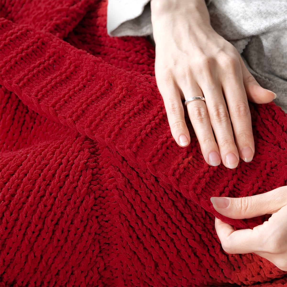 Close-up of Chevron Chenille Knit Throw Blanket in Red highlighting plush chenille texture and soft touch. #color_Christmas Red