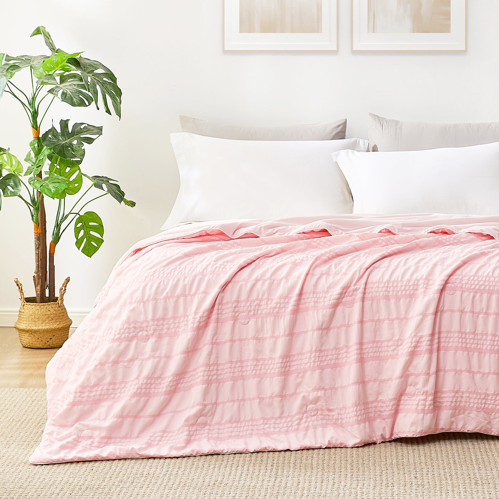Cozy Bliss Seersucker cooling comforter in pink, soft and breathable for cool sleep. #color_Pink