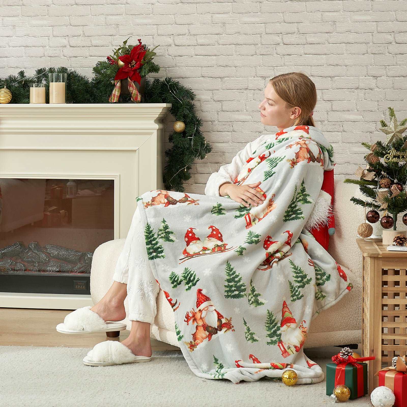 Woman relaxing with Gnomes MilkyPlush™ throw blanket, Christmas cozy vibes #color_ Gnome in Sleigh