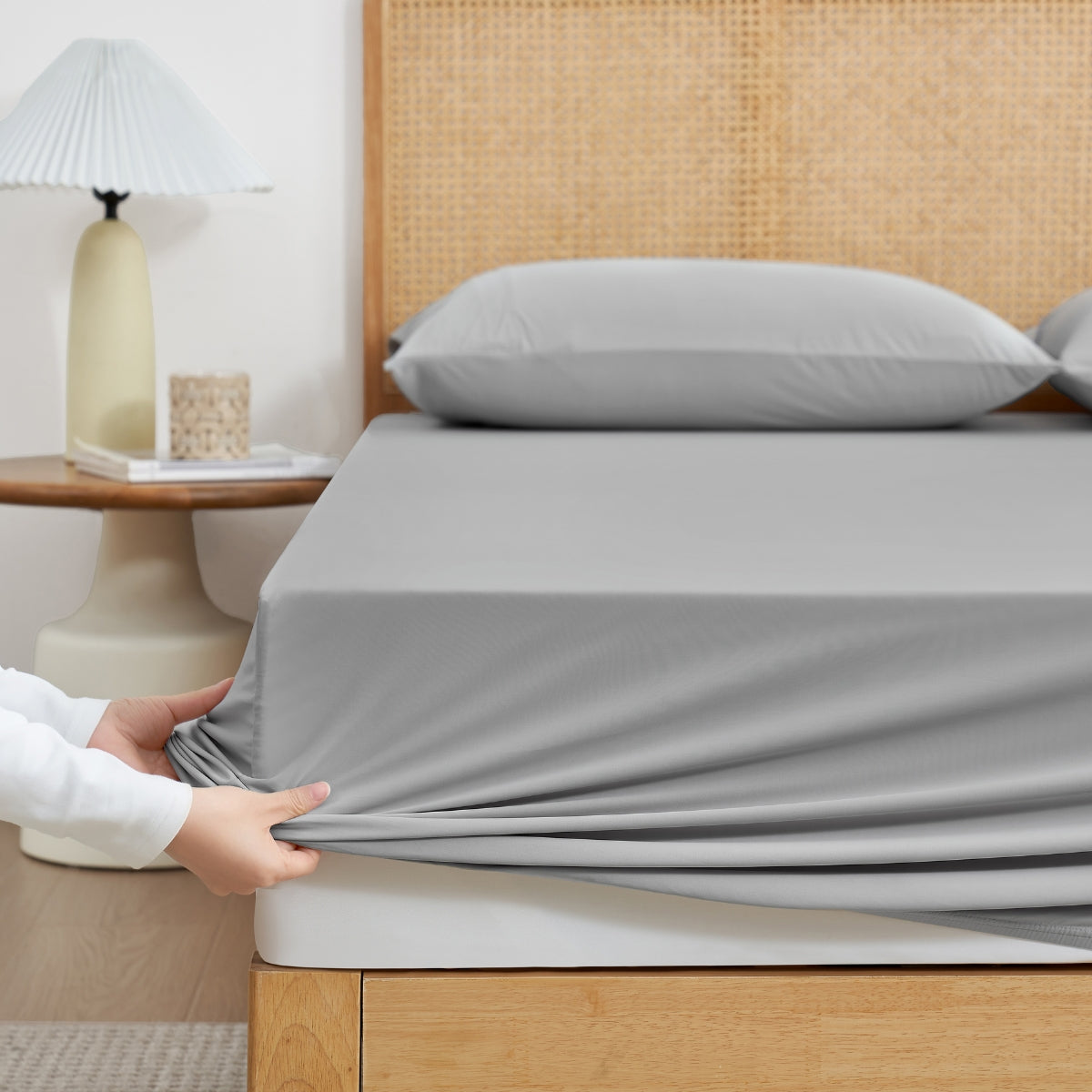 Cozy Bliss Cream-colored cooling fitted sheet set with pillowcases front view. #Color_Light Grey