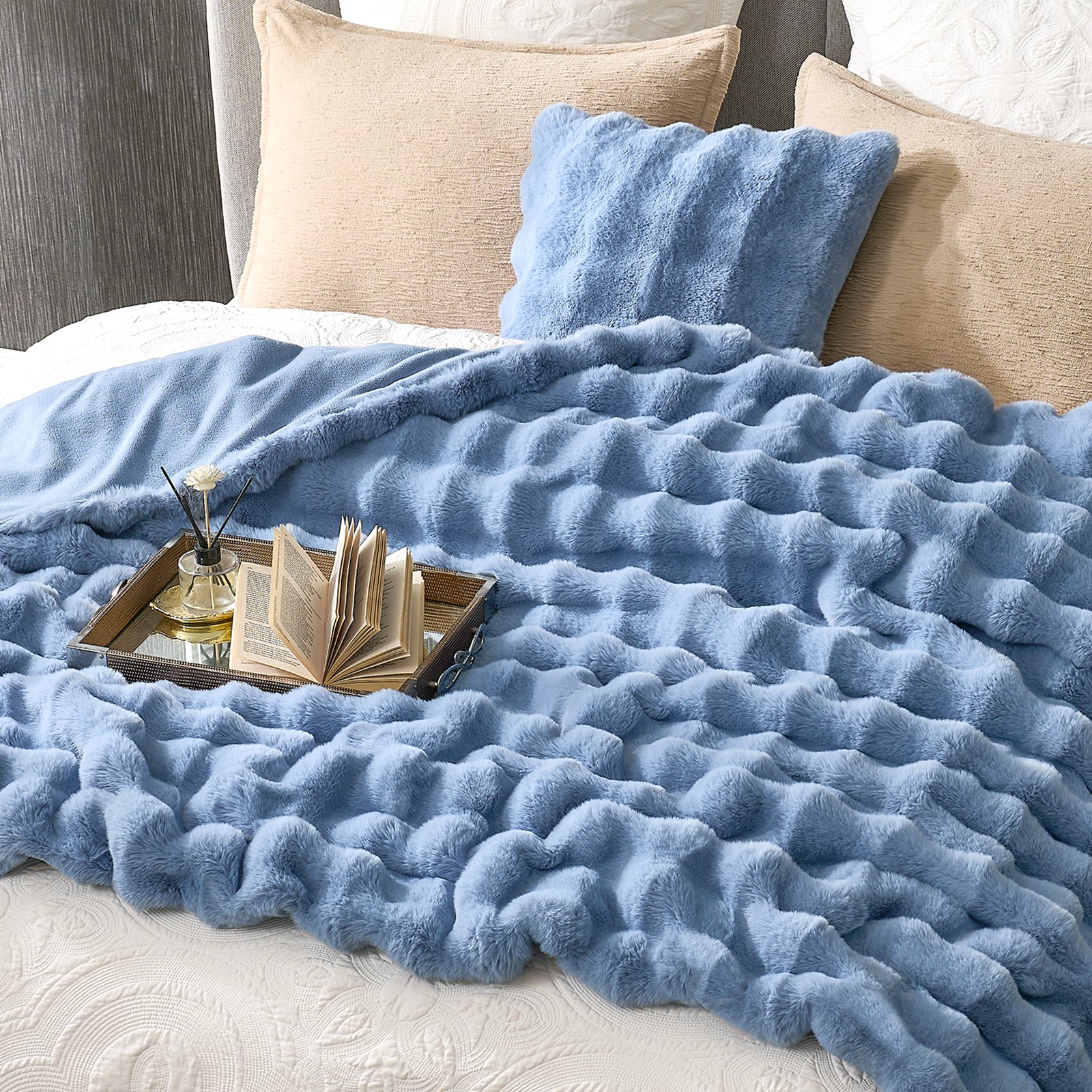 Misty blue faux fur throw blanket on cozy bed. Cozy and soft blanket for bedroom comfort #color_Misty Blue