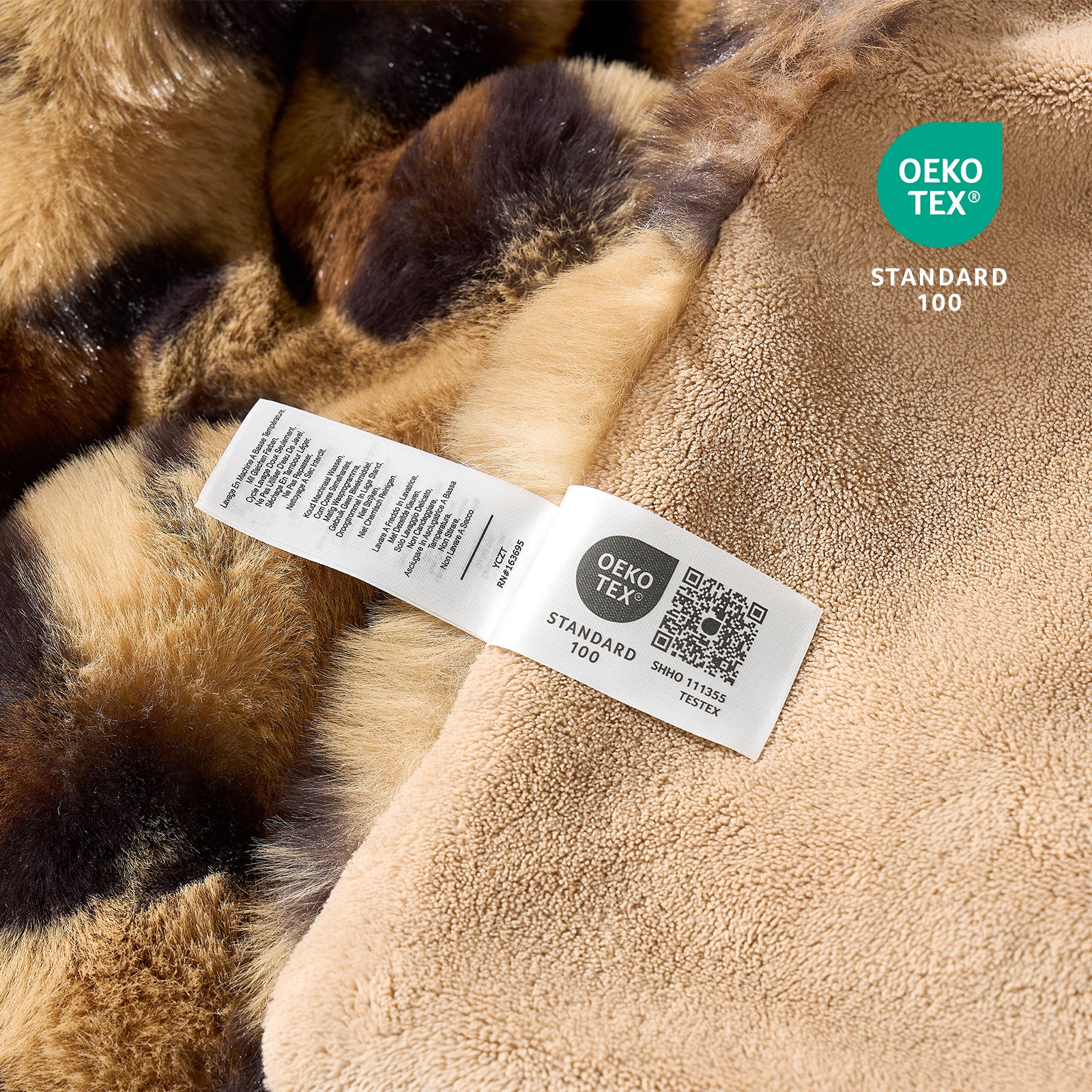 Close-up of OEKO-TEX certified faux fur brown leopard blanket fabric. #Color_Brown Leopard